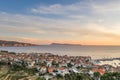 Aerial drone shot of Komiza village on Vis Island in Croatia during sunset with view of Bisevo island in summer Royalty Free Stock Photo