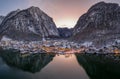 Aerial drone shot of Lahn village covered by snow by lake in Aus Royalty Free Stock Photo