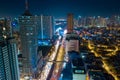 Aerial drone shot a Manila night Skyline. Elevated, night view of Makati, the business district of Metro Manila.