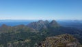 Aerial drone shot of the mountains in Hamaroy, Nordland, Norway, and the sea in the back