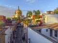 Aerial Drone Shot From Narrow street in San Miguel de Allende Cathedral at evening light in Guanajuato, Mexico Royalty Free Stock Photo