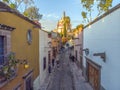 Aerial Drone Shot From Narrow street in San Miguel de Allende Cathedral at evening light in Guanajuato, Mexico Royalty Free Stock Photo