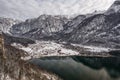 Aerial drone shot of Obertraun village in snow mountain valley by Hallstatt lake in Austria in winter Royalty Free Stock Photo