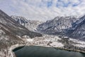 Aerial drone shot of Obertraun village in snow mountain valley by Hallstatt lake in Austria in winter Royalty Free Stock Photo