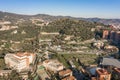 Aerial drone shot of park guell hill in Barcelona in morning