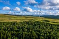 Aerial drone shot of several clean energy wind turbines