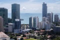 Aerial drone shot of the tall buildings of Panama against the ocean view, Latin America