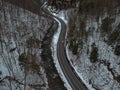 Aerial drone shot of winding road through the mountains. Royalty Free Stock Photo