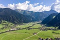 Aerial drone shot of Zillertal valley with clouds in Tyrol Austria summer