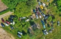 Aerial drone top down view on car junkyard with old destroyed cars and old rusted parts waiting for recycling