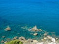 Drone photography of the rocky coast with a small sandy beach.