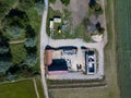 Aerial drone top view of a building site working on a barn conversion in the countryside. Building, conversion, new life,