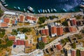 Aerial drone top view photo of colourful wooden traditional fishing boat in turquoise sea shore of Simy island, Greece