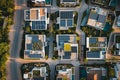 Aerial drone top view photo of modern urban development with solar panels on the house rooftops Architectural solution for country