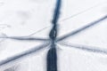 Aerial drone top view of snow covered frozen lake or river surface with big cracked ice diagonal lines. Natural winter Royalty Free Stock Photo