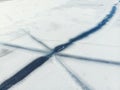 Aerial drone top view of snow covered frozen lake or river surface with big cracked ice diagonal lines. Natural winter Royalty Free Stock Photo