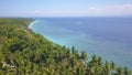 Aerial drone on on tropical paradise island of Asia with palm trees vegetation coastline jungle with an amazing beautiful sea wat Royalty Free Stock Photo