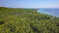 Aerial drone on on tropical paradise island of Asia with palm trees vegetation coastline jungle with an amazing beautiful sea wat Royalty Free Stock Photo