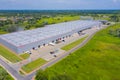 Aerial drone on trucks and logistic center. Warehouse aerial. Modern logistics center, white van and trailers standingon ramp Royalty Free Stock Photo
