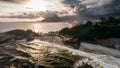 Aerial drone view above Praia do Diabo, Arpoador and Ipanema Beaches in Rio de Janeiro, Brazil on a cloudy day with many Cariocas