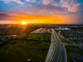 Aerial drone view of amazing sunset casting light rays across the sky