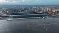 Aerial drone view Amsterdam Central Train Station with Amsterdam sign on roof. Bird's eye view autumn cityscape Royalty Free Stock Photo