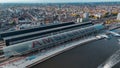 Aerial drone view Amsterdam Central Train Station with Amsterdam sign on roof. Bird's eye view autumn cityscape Royalty Free Stock Photo