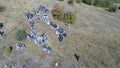 Aerial drone view of ATV quads on a dirt trail in forests. Off-road group team club enthusiasts having fun while driving