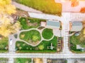 Aerial drone view of backyard garden with circle wath path, green grass lawn and trees. Landscape design and gardening Royalty Free Stock Photo