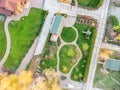 Aerial drone view of backyard garden with circle wath path, green grass lawn and trees. Landscape design and gardening Royalty Free Stock Photo