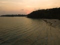 Aerial drone view of beautiful beach with sunset and palm trees of Gulf of Thailand. Kood island, Thailand. Royalty Free Stock Photo