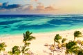 Aerial drone view of beautiful caribbean tropical beach with palms and boats during sunset. Bavaro, Punta Cana, Dominican Republic