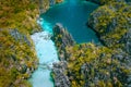 Aerial drone view of a beautiful tropical Big Lagoon at Miniloc Island, El Nido, Philippines. Tourist kayaking