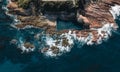 Aerial drone view of Blue Pool in Bermagui during sunrise sunset with blue sky and reflection. New South Wales