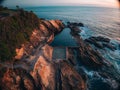 Aerial drone view of Blue Pool in Bermagui during sunrise sunset with blue sky and reflection. New South Wales