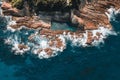 Aerial drone view of Blue Pool in Bermagui during sunrise sunset with blue sky and reflection. New South Wales