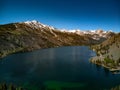 Aerial, drone view of blue sky and capped mountains over Twin Lakes Royalty Free Stock Photo