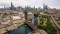 Aerial drone view of a boat sailing on the Chicago river under a bridge Royalty Free Stock Photo