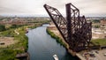 Aerial drone view of a boat sailing on the Chicago river under a bridge Royalty Free Stock Photo