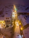 Aerial drone view of Brasov town in winter at night, Romania.