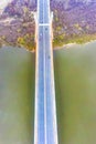 Aerial drone view. bridge  in the rays of a sunny morning. Autumn haze in the air, cars are driving across the bridge Royalty Free Stock Photo