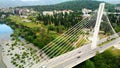 Aerial drone view of cable stayed Millennium bridge and Moraca river in Podgorica, Montenegro Royalty Free Stock Photo