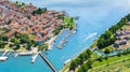 Aerial view of colorful Burano island in Venetian lagoon sea from above, Italy