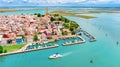 Aerial view of colorful Burano island in Venetian lagoon sea from above, Italy Royalty Free Stock Photo