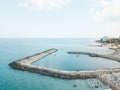 Aerial Drone View Of Concrete Pier On Turquoise Water At The Black Sea Resort Costinesti Of Romania