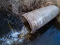Aerial drone view, concrete pipe transporting the polluted sewage water Royalty Free Stock Photo