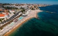 Aerial drone view of crowded Tamariz beach in Estoril, Portugal during the summer Royalty Free Stock Photo