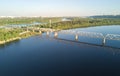 Aerial drone view of Dnepr river and Rybalskiy island from above, bridges and skyline of Kiev city, Ukraine