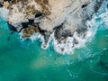 Aerial Drone View Of Dramatic Ocean Waves Crushing On Rocky Shore