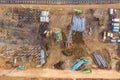 Aerial drone view of excavator loading the tipper truck at the construction site Royalty Free Stock Photo